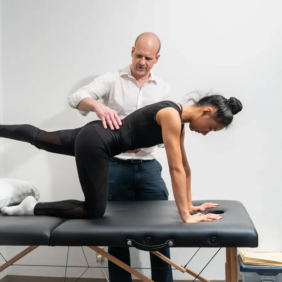 Dr. Ed guiding a patient through a core stability exercise for back pain at Chatsworth Physical Therapy