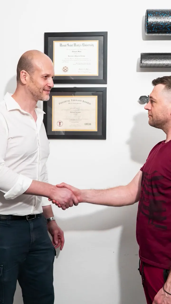Dr. Ed shaking hands with Matt, a frozen shoulder patient, at Chatsworth Physical Therapy